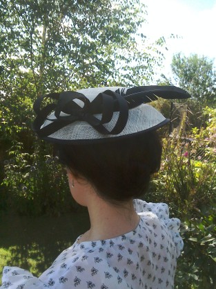 Black and cream hat with feather worn Thirties style