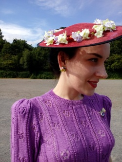 Modern red tilt hat dressed with flowers