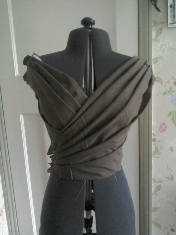 Wrapover front folds of bodice